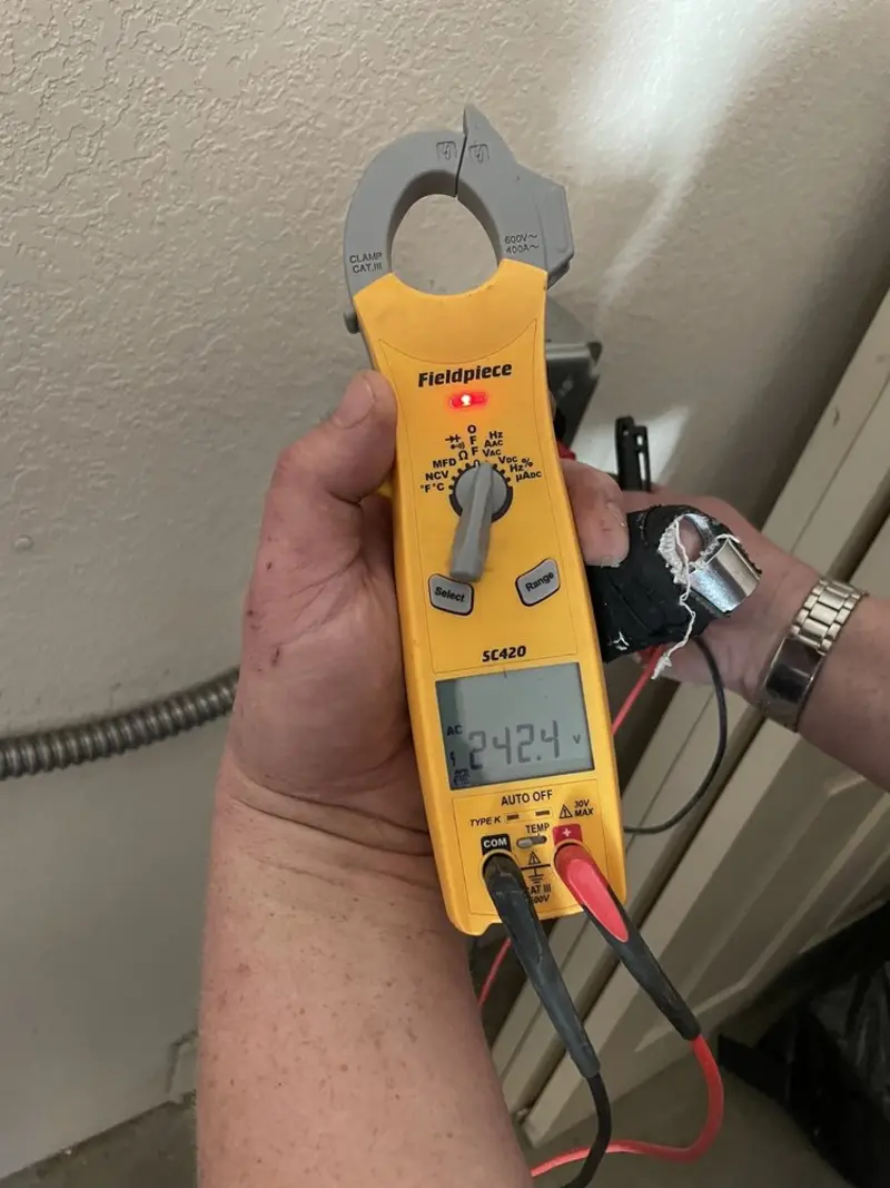 Voltage testing with clamp meter during Generator Installation in Kennesaw State University